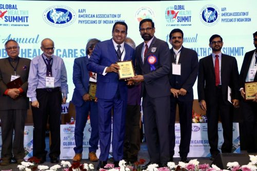 Receiving award from AAPI President Dr Ravi Kolli